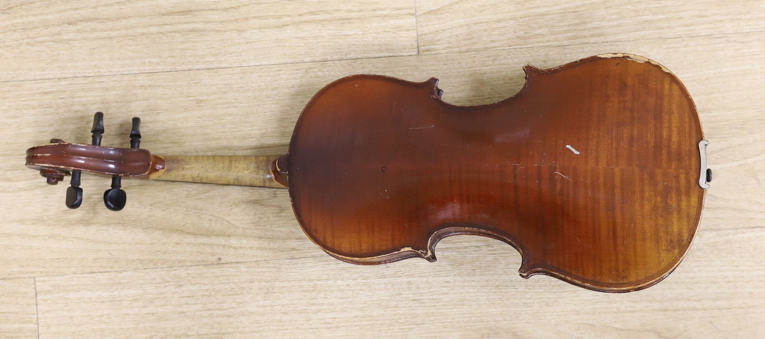 A cased violin, with bow